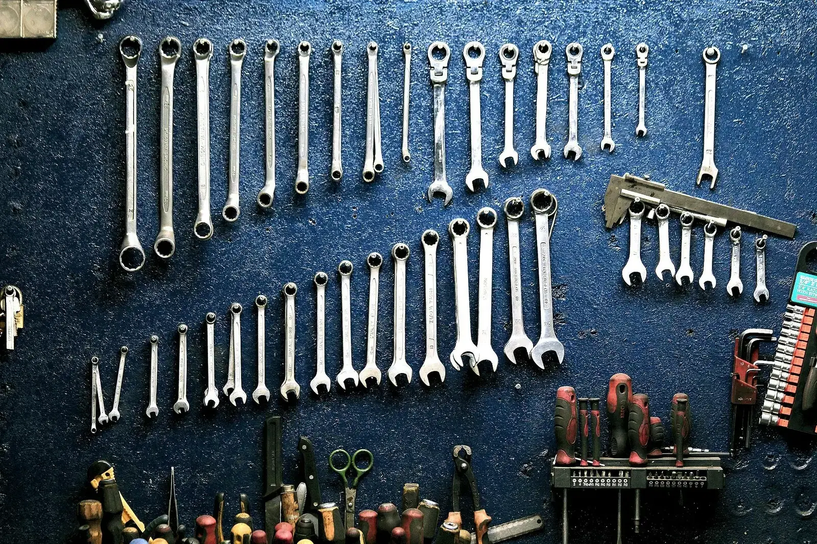 An organized wall of mechanic’s hand tools